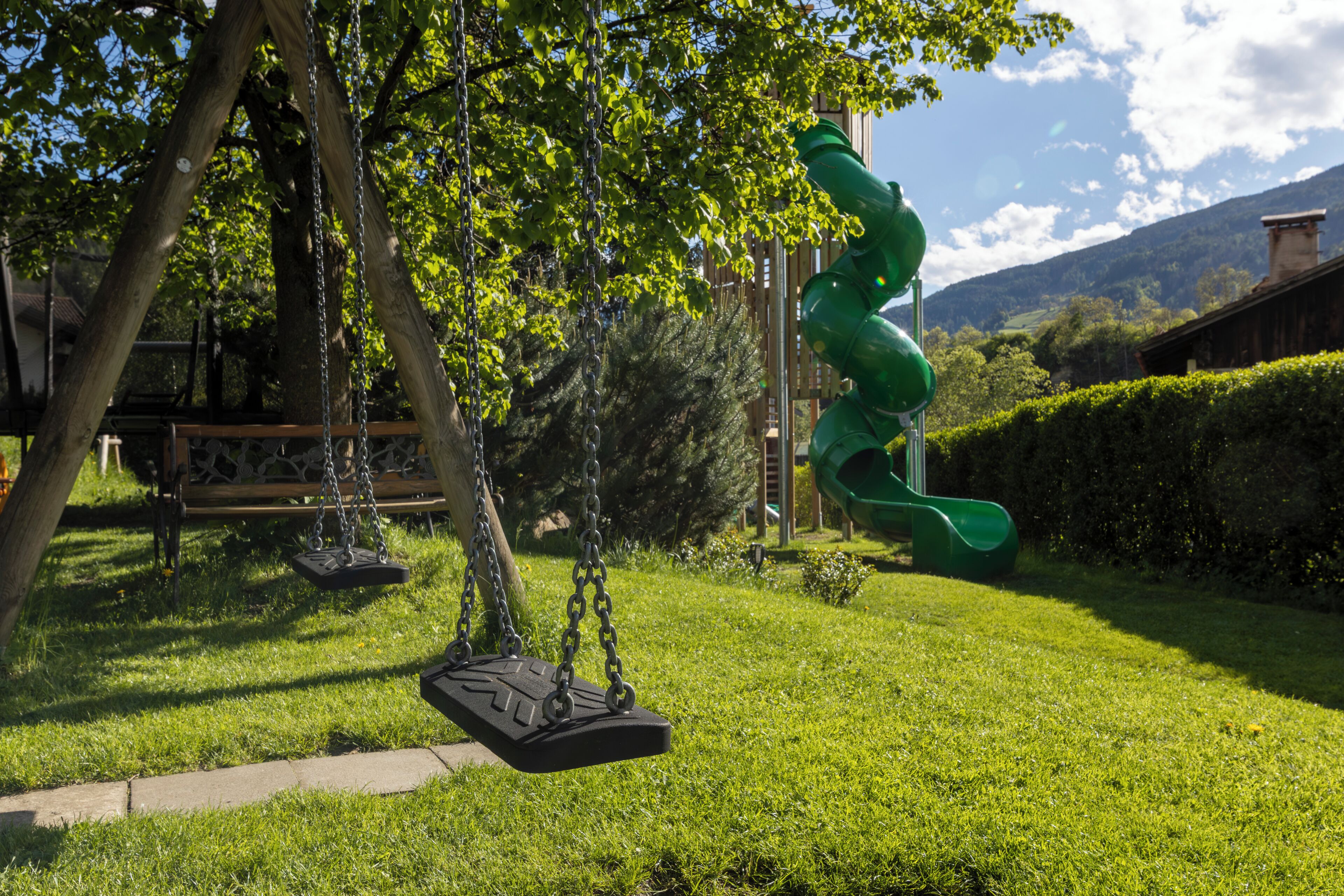 A park with swings and a slide.