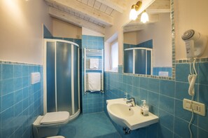 Shower, rainfall showerhead, bidet, towels