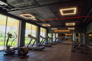 A gym with treadmills, elliptical machines, and weight equipment. - Kefaluka Resort - All Inclusive (Bodrum)