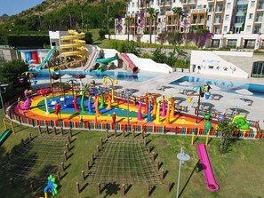 A water park with slides, a wave pool, and a playground area.