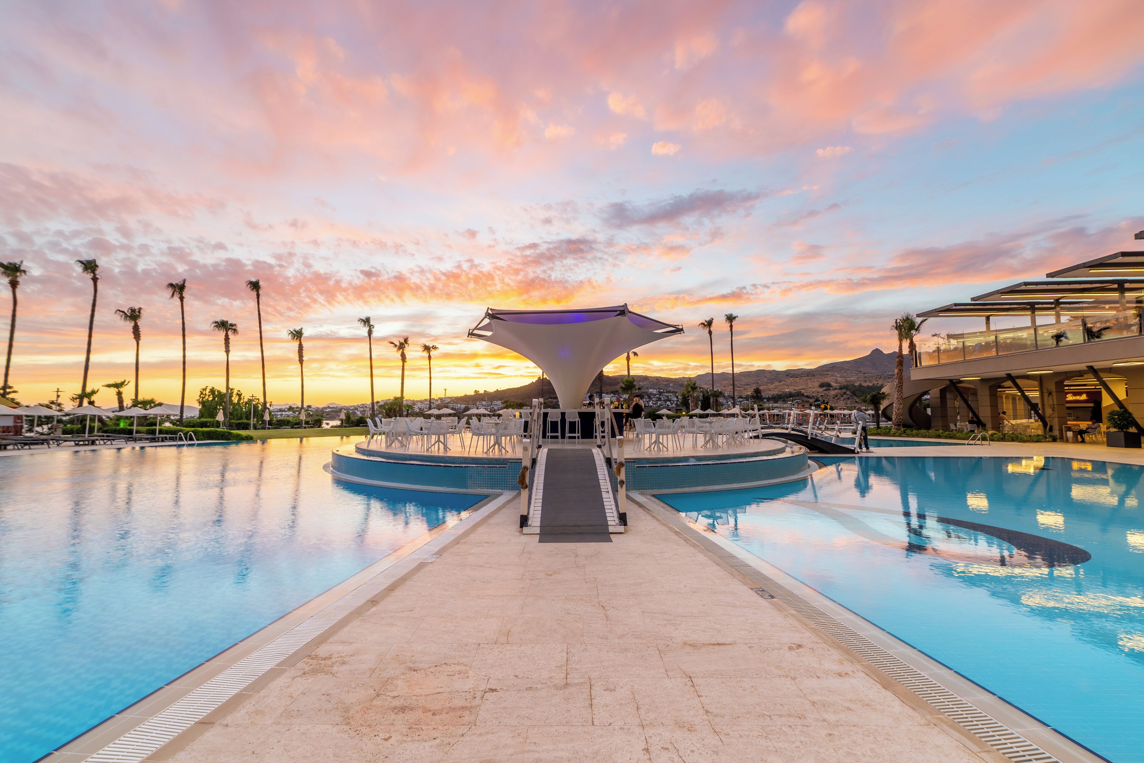6 bars/lounges, poolside bar, beach bar