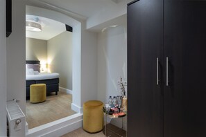 Double Room, Patio (Basement) | Minibar, in-room safe, desk, blackout drapes