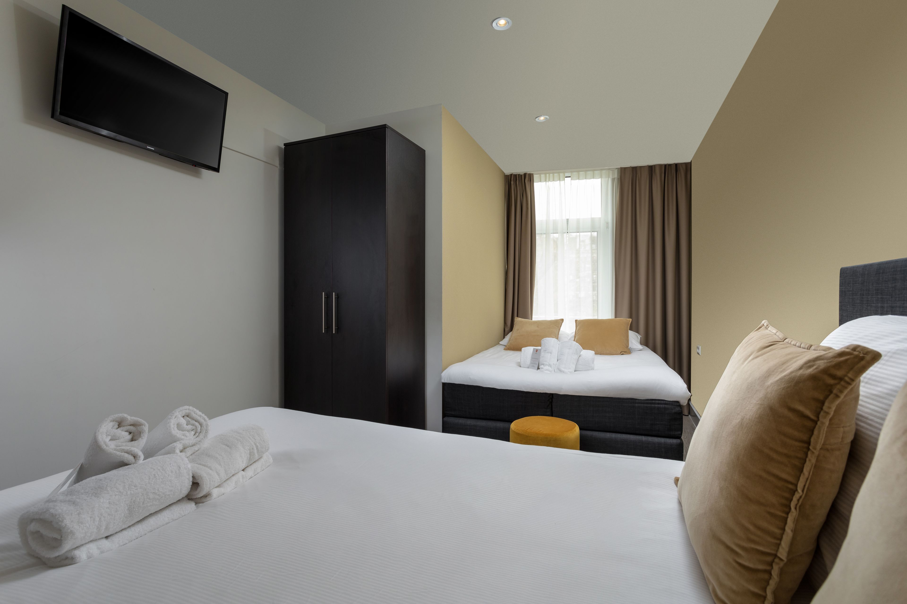 small family room | minibar, in-room safe, desk, blackout curtains