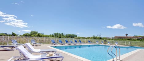 Seasonal outdoor pool, open 10:00 AM to 8:00 PM, sun loungers