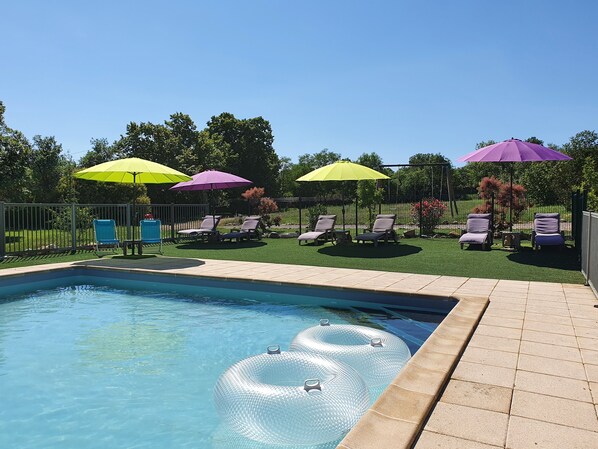 Seasonal outdoor pool, pool umbrellas, pool loungers