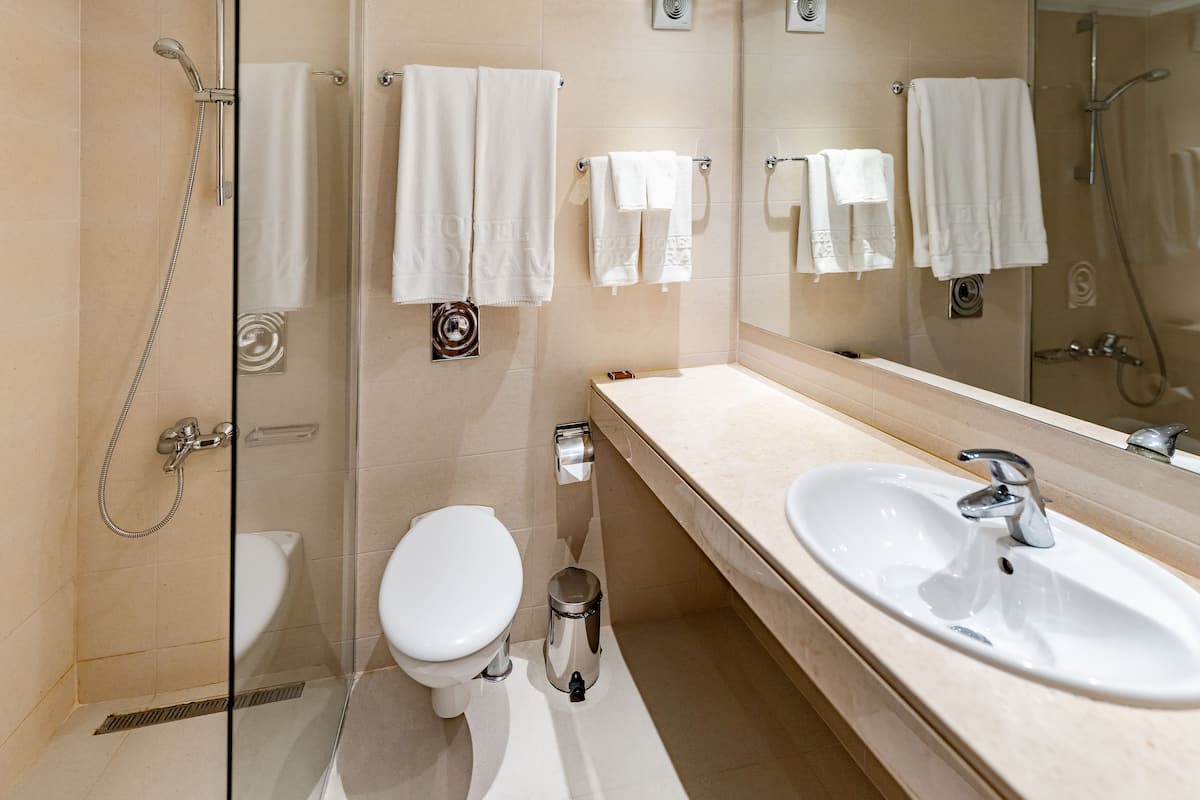 shower, rainfall showerhead, designer toiletries, hair dryer