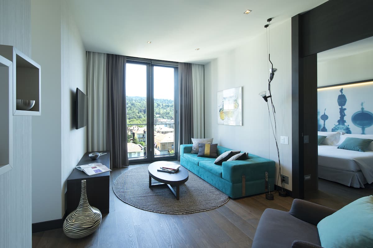 Superior Suite | Living room | 49-inch Smart TV with satellite channels, TV