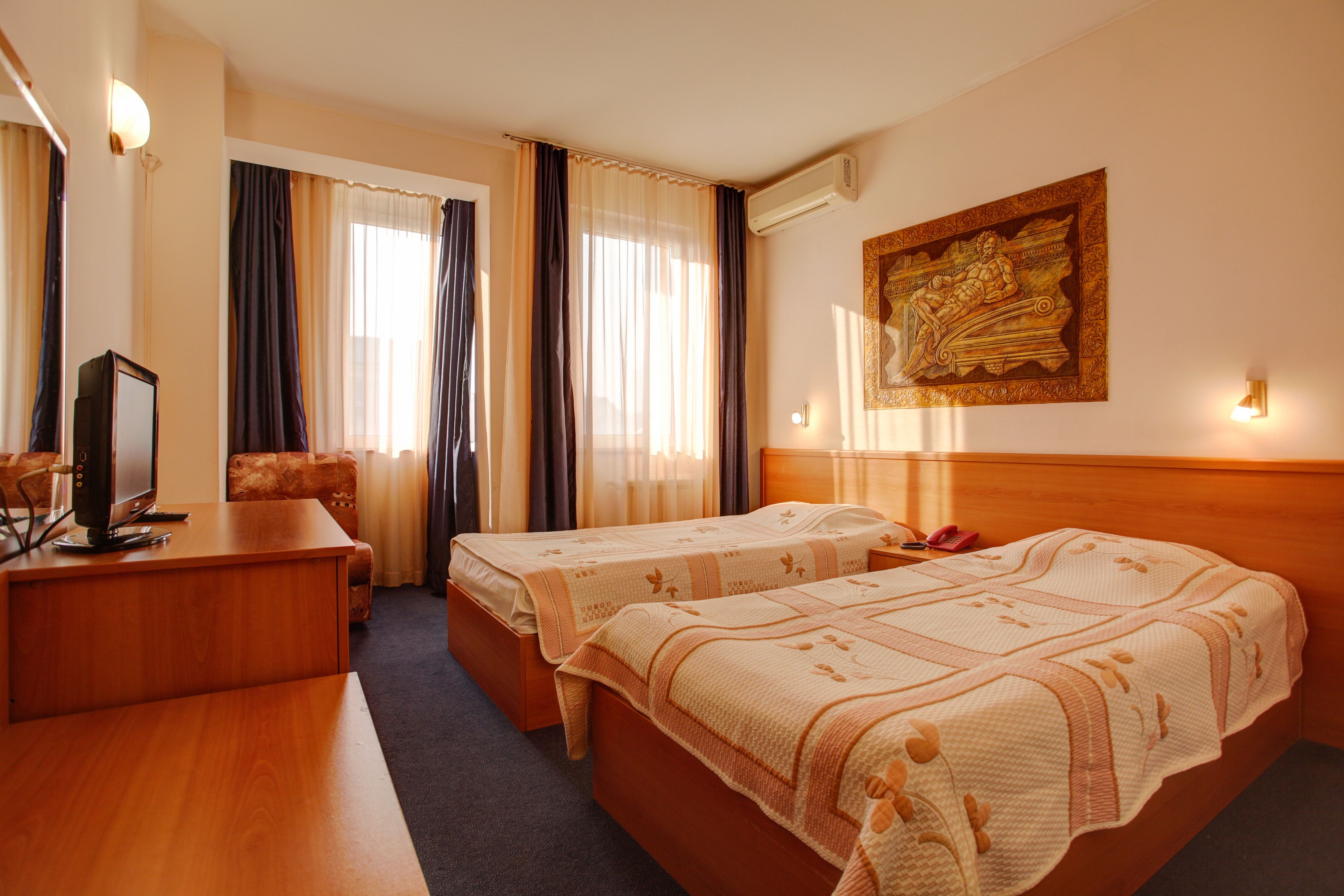 Standard Double or Twin Room | Minibar, in-room safe, iron/ironing board, free WiFi