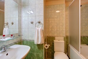 A bathroom with a sink, toilet, and shower. - Central Plaza Hotel (Sofia)