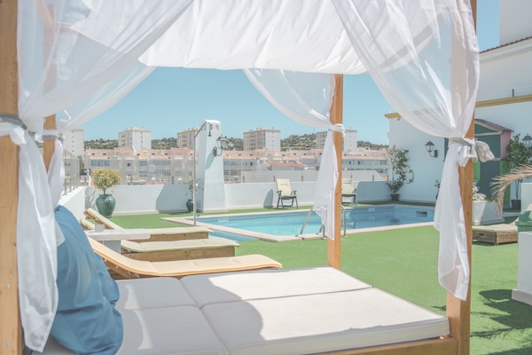 Outdoor pool, open 8 AM to 8 PM, pool loungers