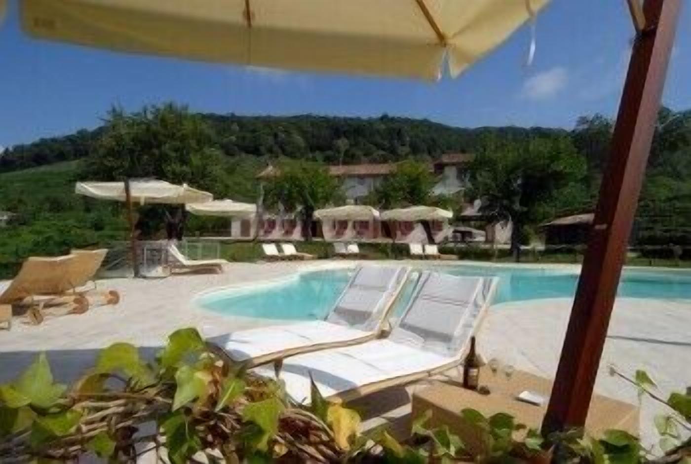 Seasonal outdoor pool, open 9:00 AM to 7:00 PM, pool umbrellas