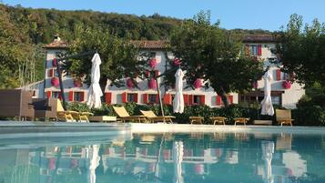 Seasonal outdoor pool, open 9:00 AM to 7:00 PM, pool umbrellas