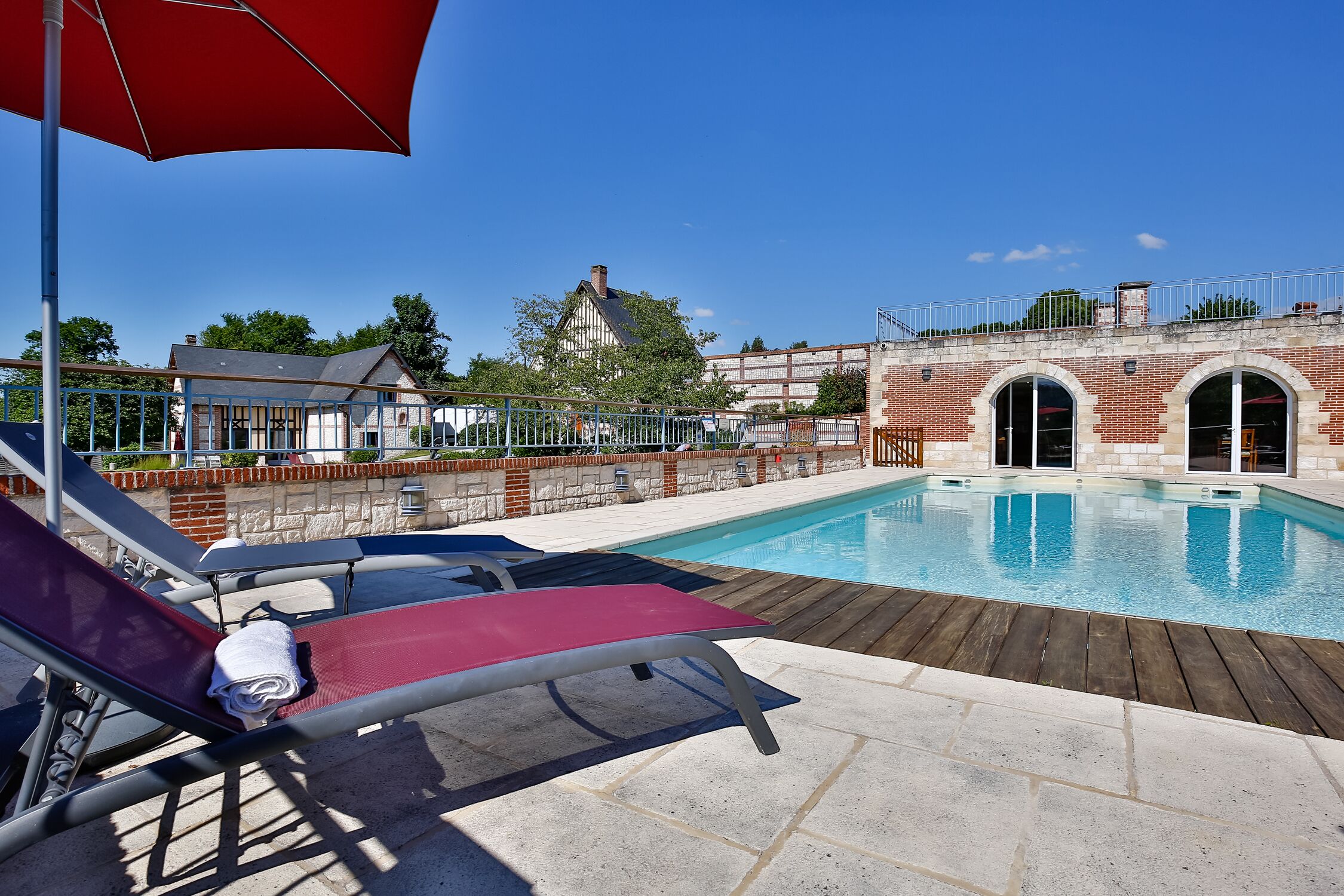 Seasonal outdoor pool, open 10:00 AM to 8:00 PM, pool umbrellas