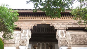 An ornate archway with intricate tile work and a traditional tiled roof. - Riad Daria Suites & Spa (Marrakech)