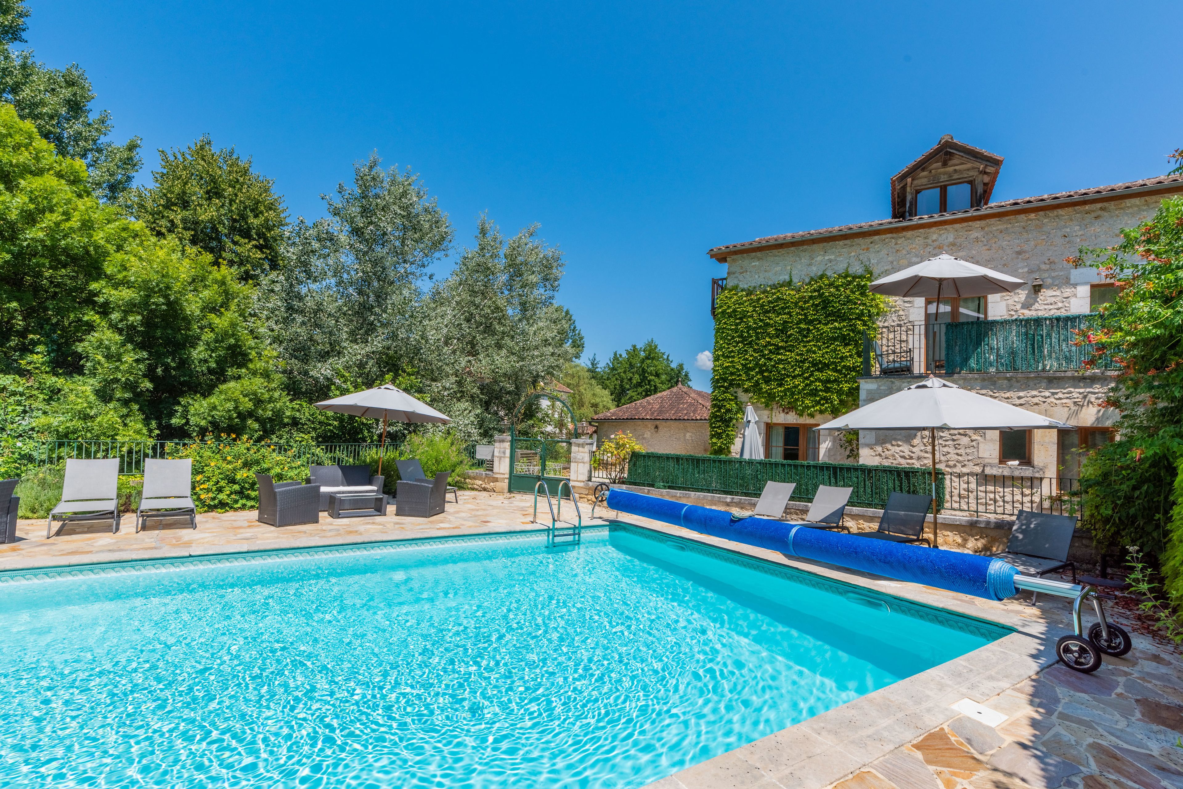 outdoor pool, pool umbrellas, pool loungers