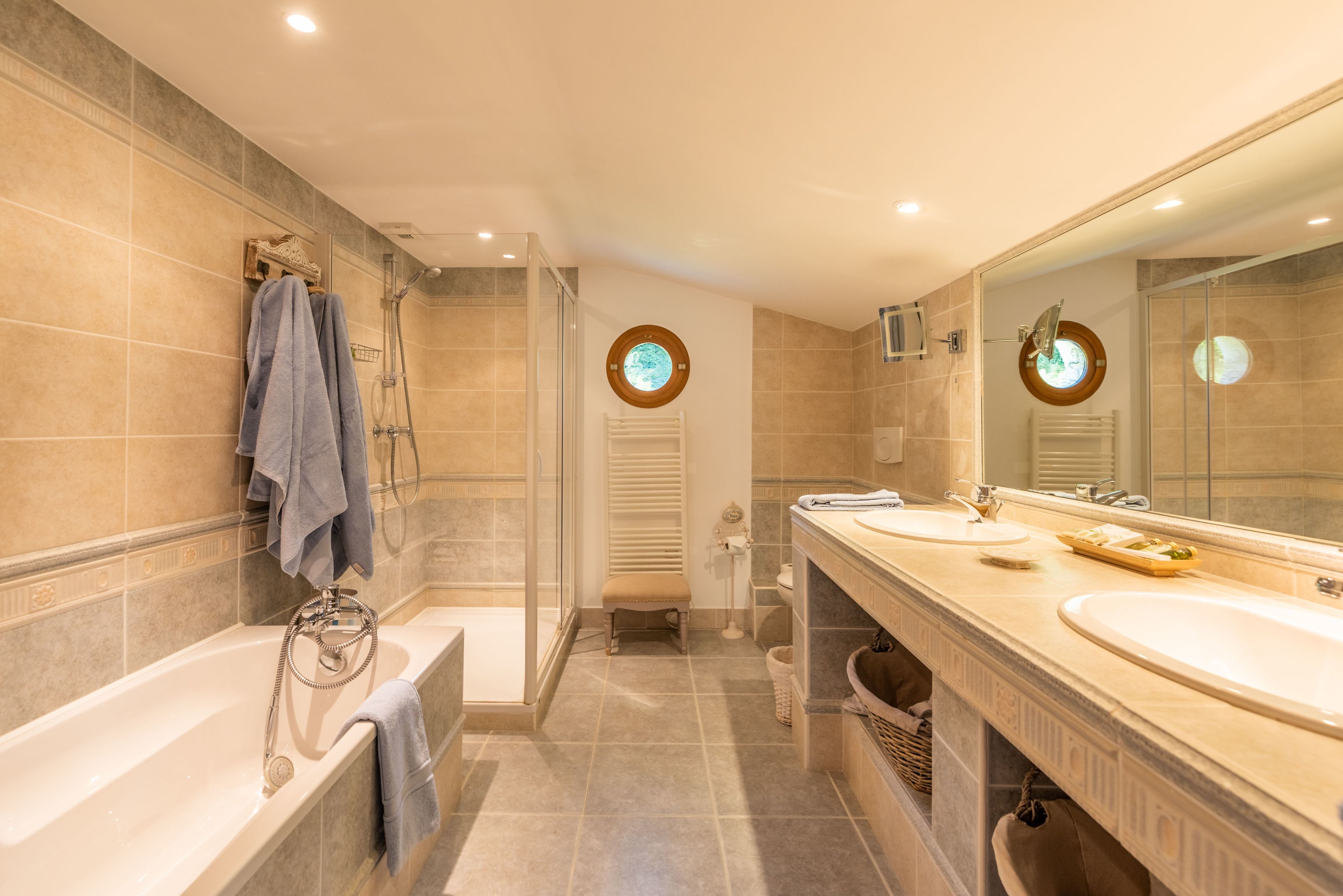 luxury loft | bathroom | designer toiletries, hair dryer, bathrobes, slippers