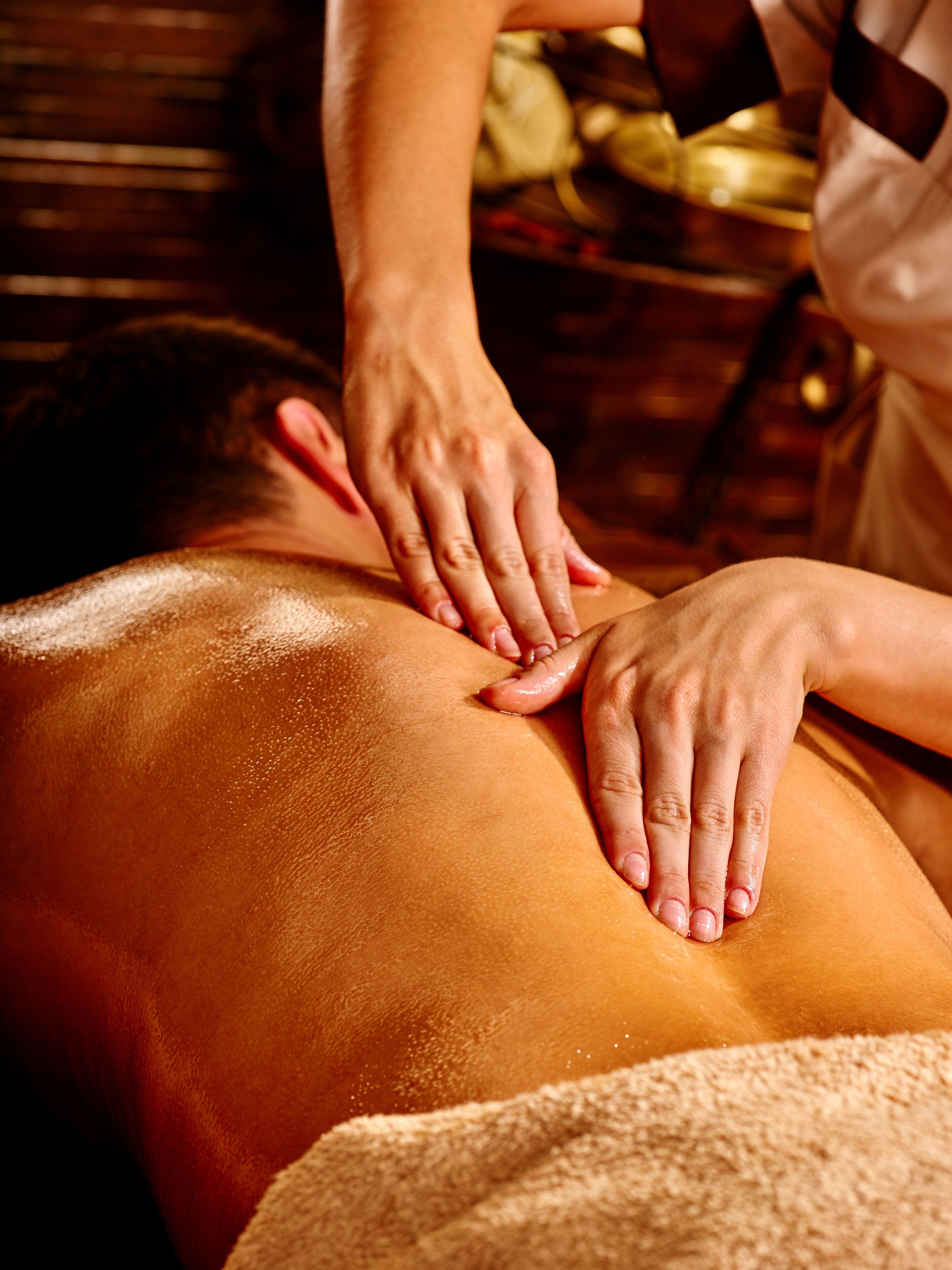 A person receiving a back massage.