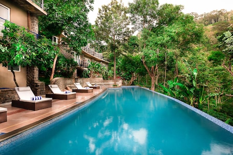 Indoor pool, outdoor pool. Great trails yercaud by GRT Hotels