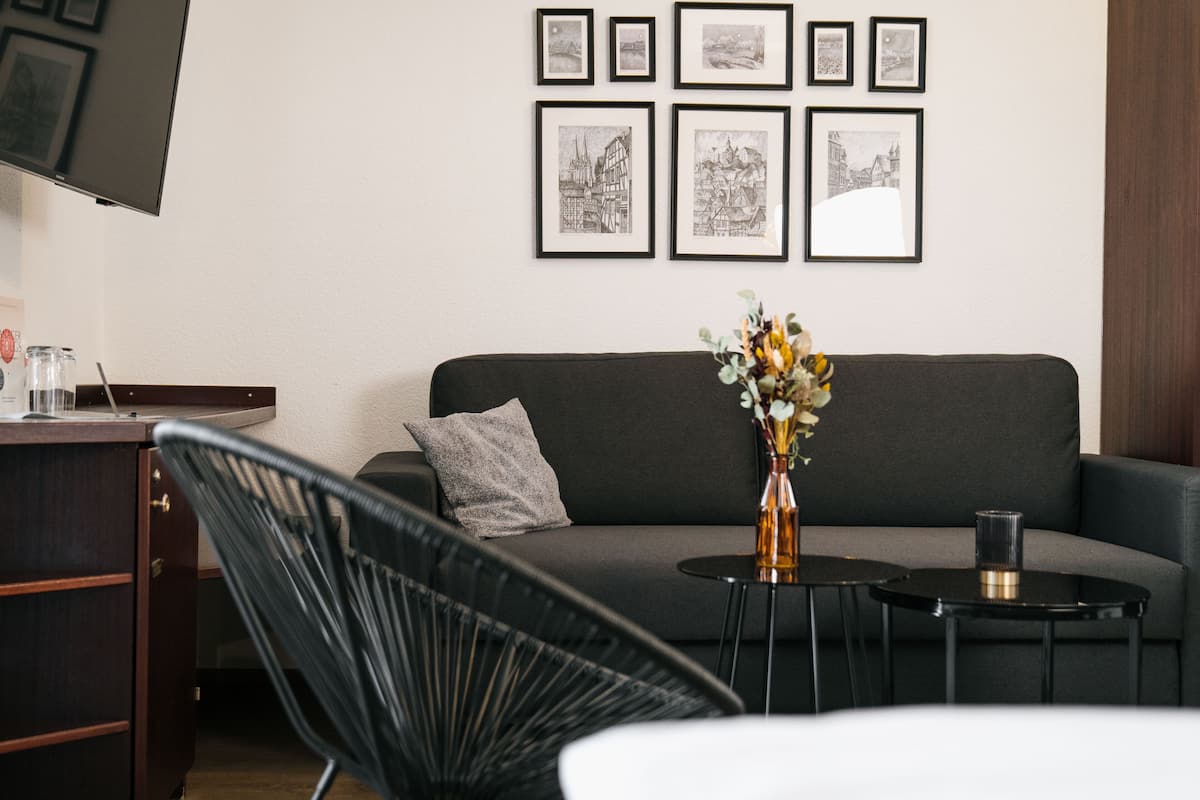 comfort double room (box spring bed 180x200) | living area | 24-inch tv with cable channels