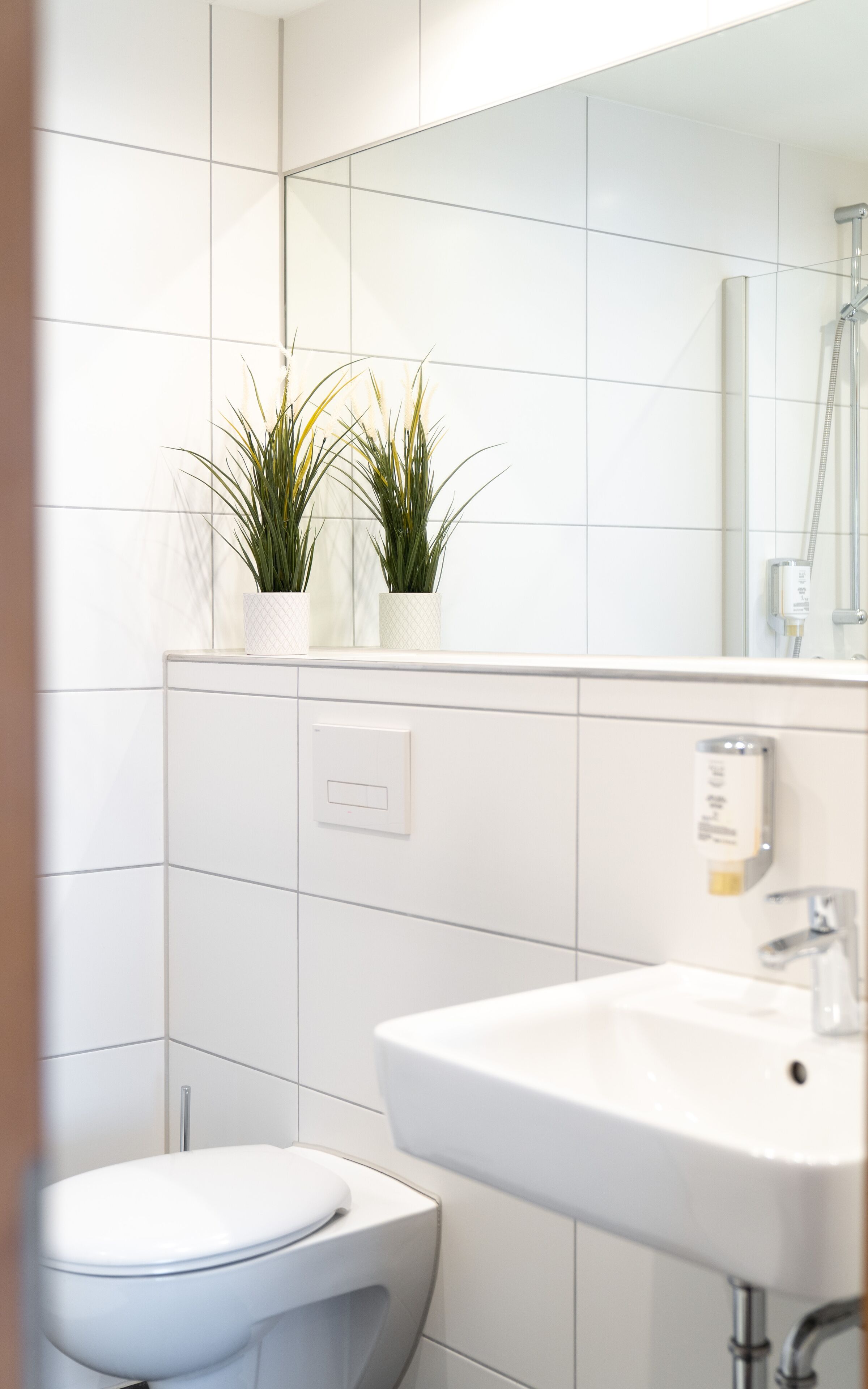 shower, rainfall showerhead, hair dryer, towels