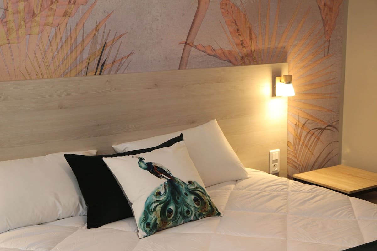 family room | desk, blackout curtains, soundproofing, iron/ironing board