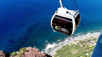 Ride the cable car to Fajões dos Padres for breathtaking views of the coastal landscape.
