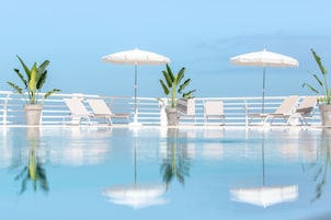 Outdoor pool, pool umbrellas, sun loungers