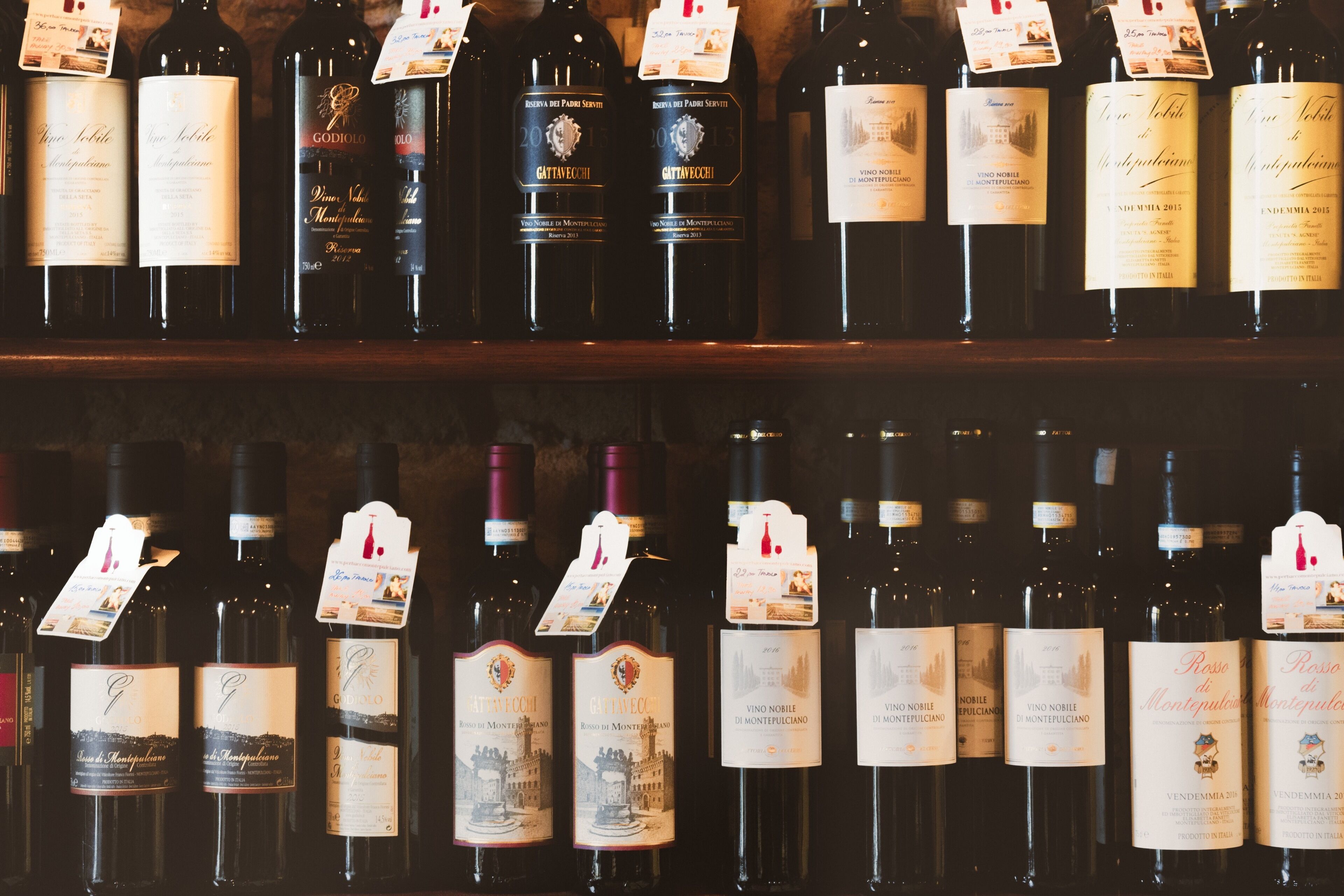 A variety of wine bottles displayed on shelves.