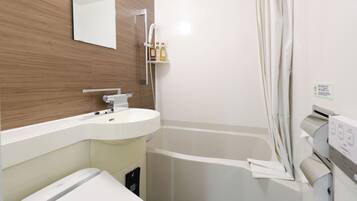 Un baño moderno con un lavamanos blanco, un inodoro, una ducha con cortina y un espejo en la pared.