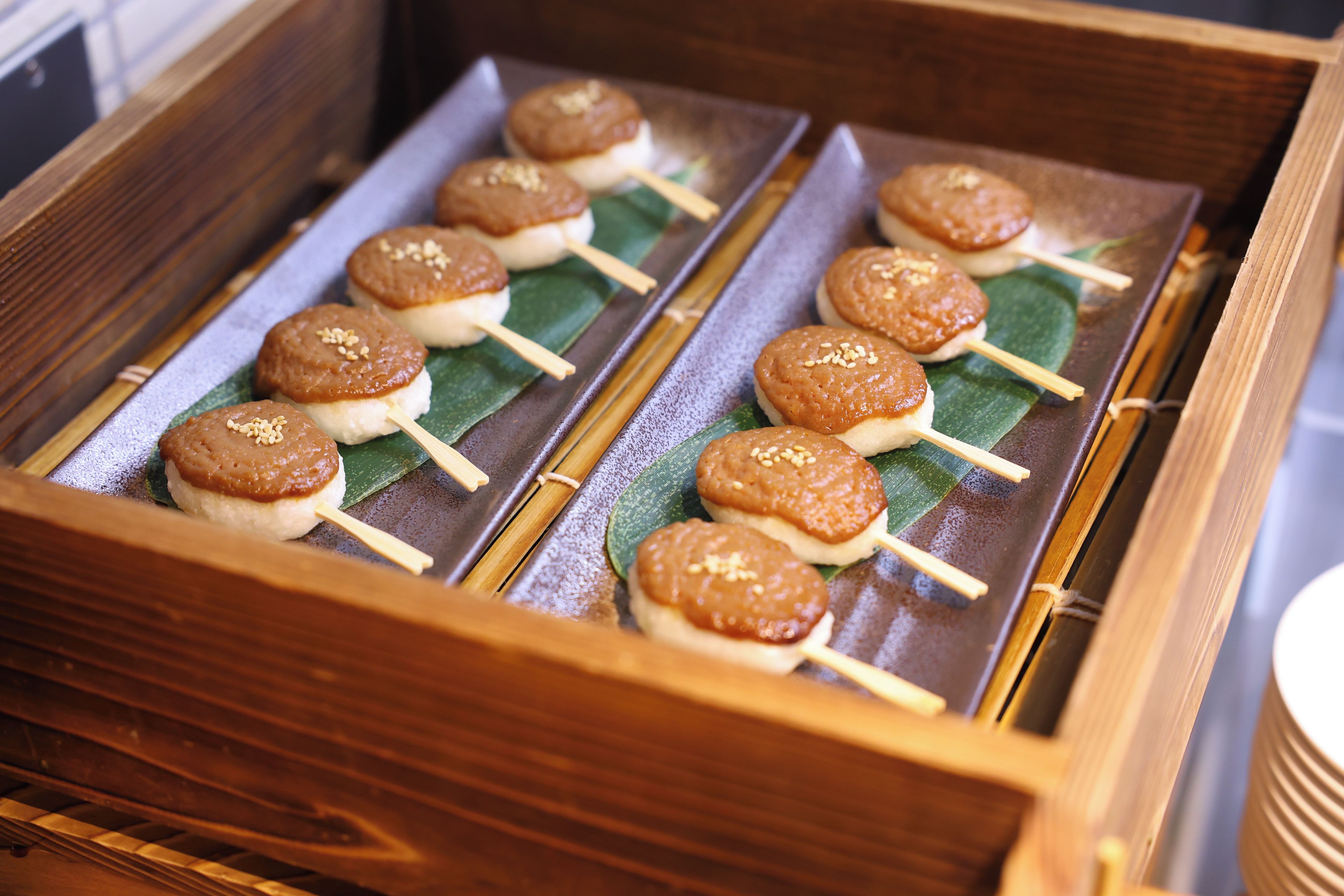 A wooden box containing food items.