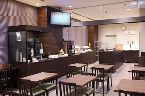 A hotel lobby with a reception desk, seating area, and a television mounted on the wall. - Dormy Inn Matsumoto Natural Hot Spring (Matsumoto)