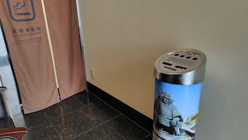 A trash can with a graphic of a Viking in a castle.