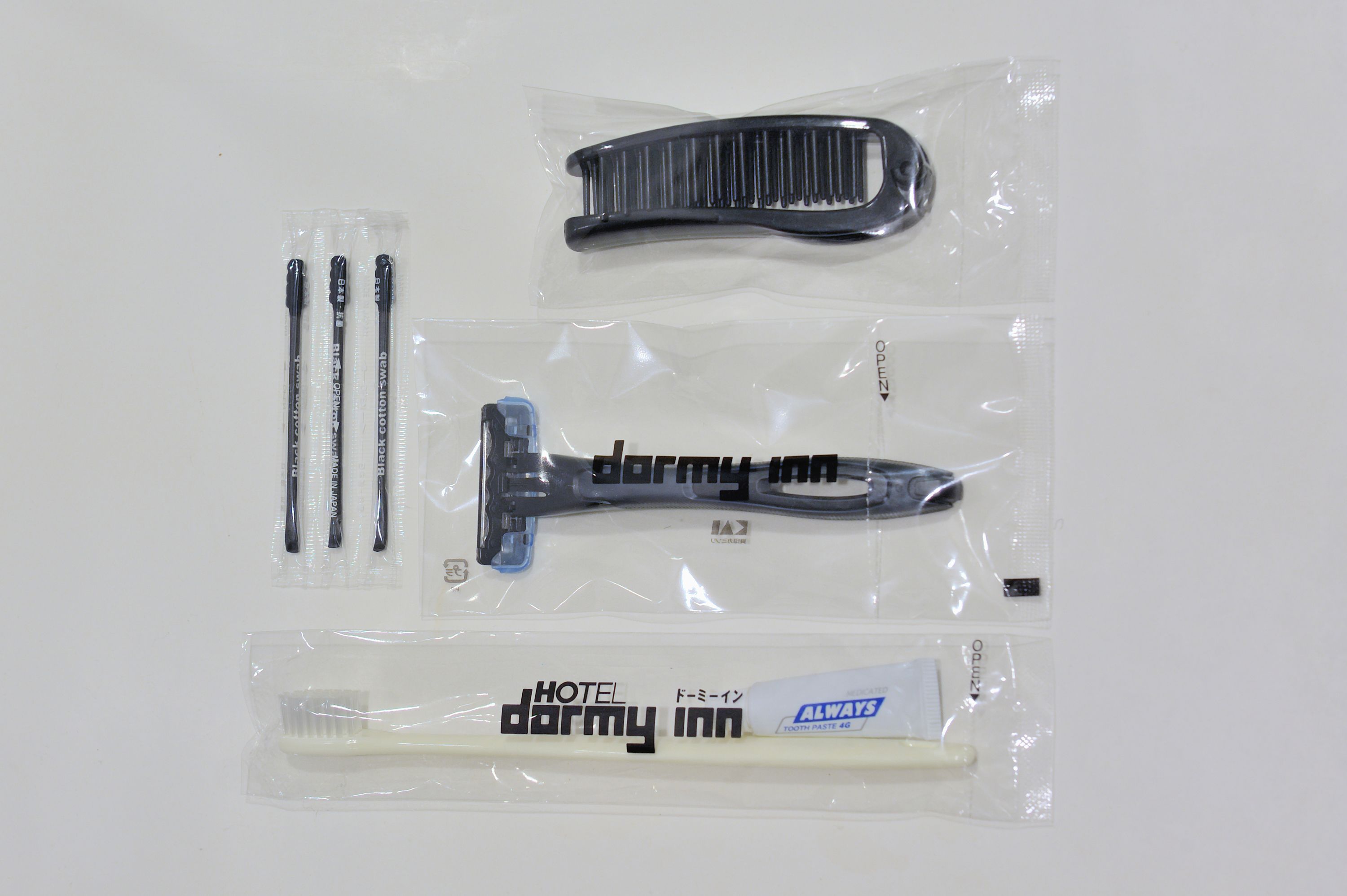 A package containing a comb, brush, and a toothbrush labeled "darmy inn".
