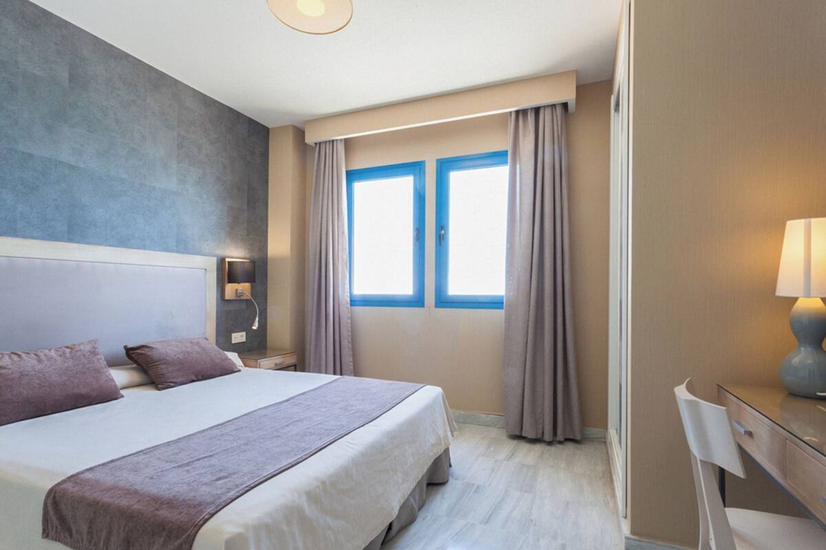 Desk, laptop workspace, blackout curtains, soundproofing