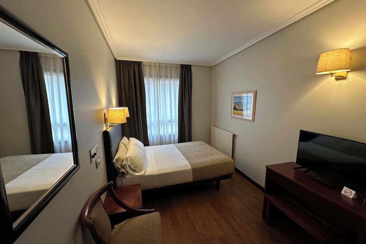 Desk, blackout drapes, WiFi (free), bed sheets