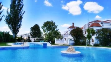 Indoor pool, outdoor pool, pool umbrellas, sun loungers