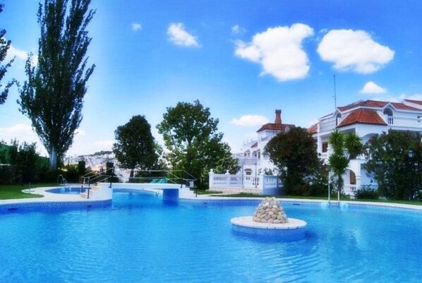 Indoor pool, outdoor pool, pool umbrellas, pool loungers