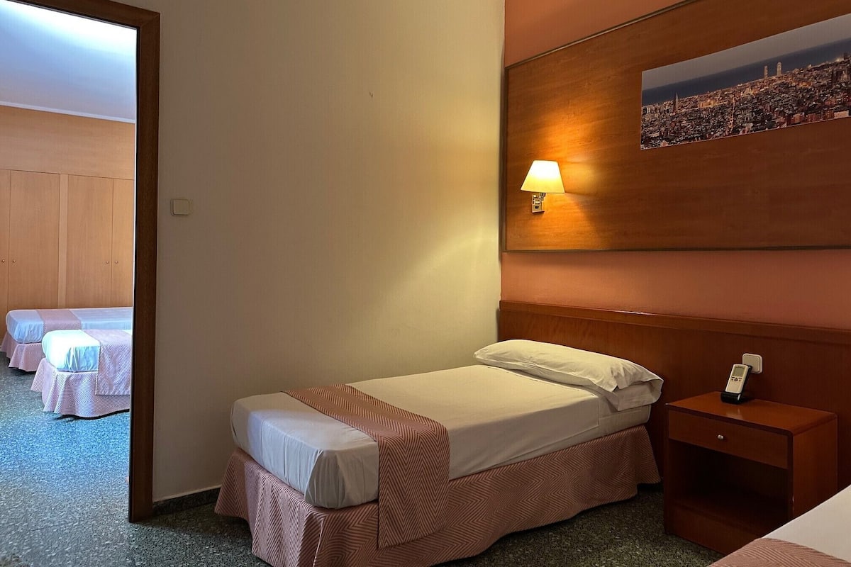 Economy Quadruple Room | In-room safe, desk, free WiFi, bed sheets