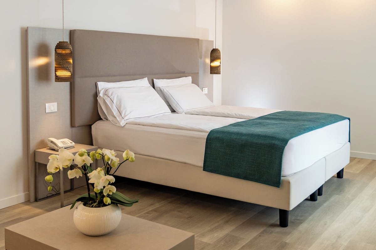 junior suite, lake view | 1 bedroom, premium bedding, minibar, in-room safe