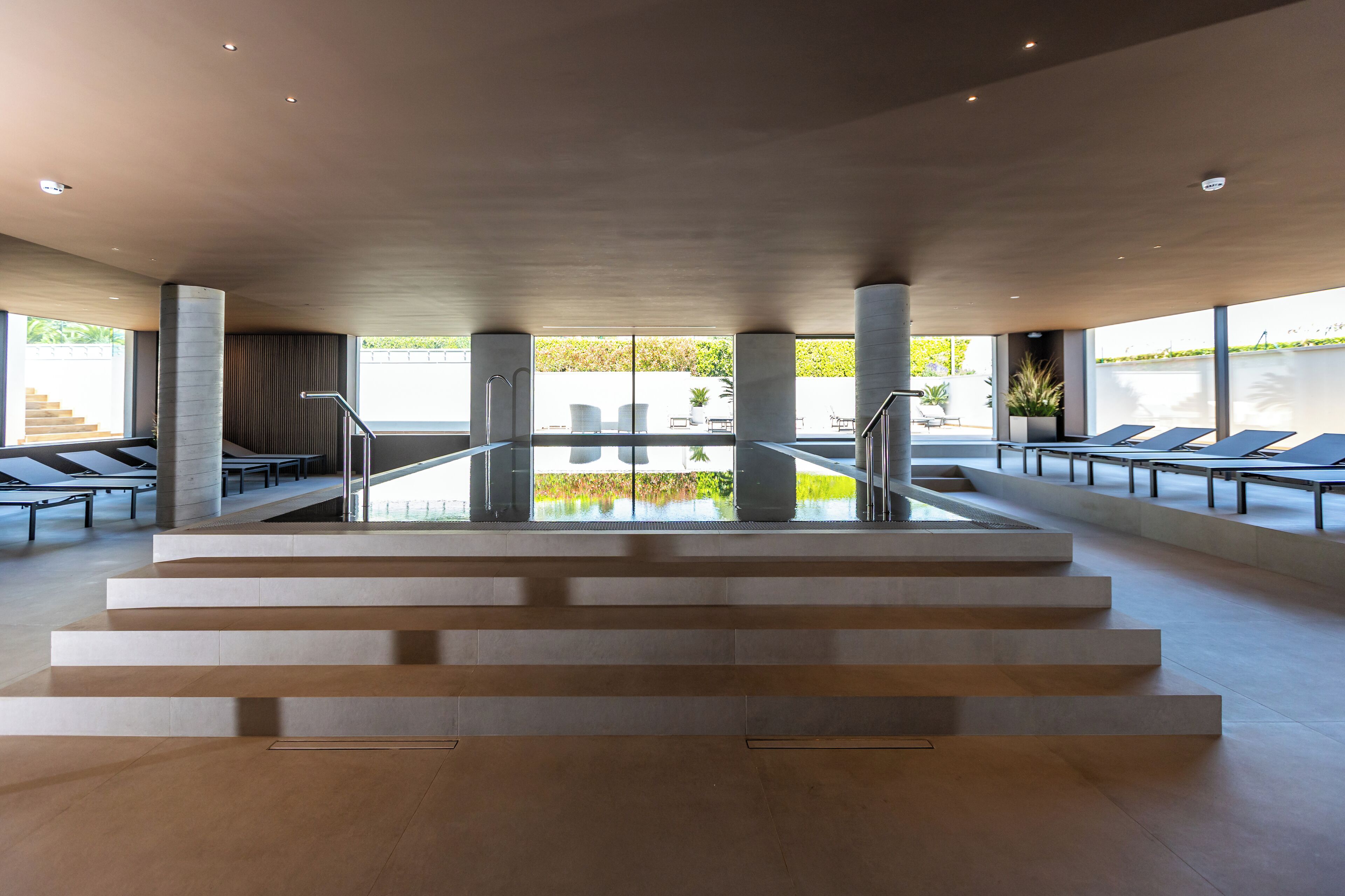 indoor pool, seasonal outdoor pool, pool umbrellas, pool loungers