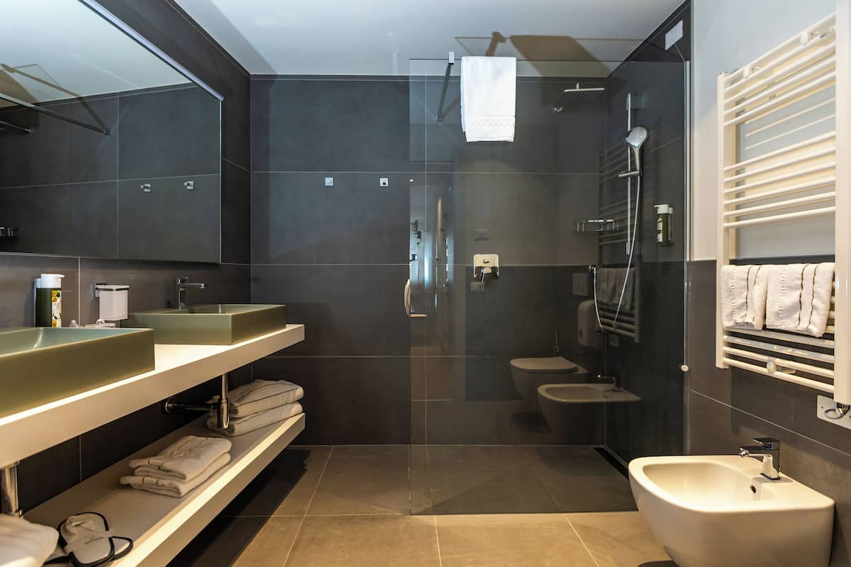 studio suite | bathroom | shower, free toiletries, hair dryer, bathrobes