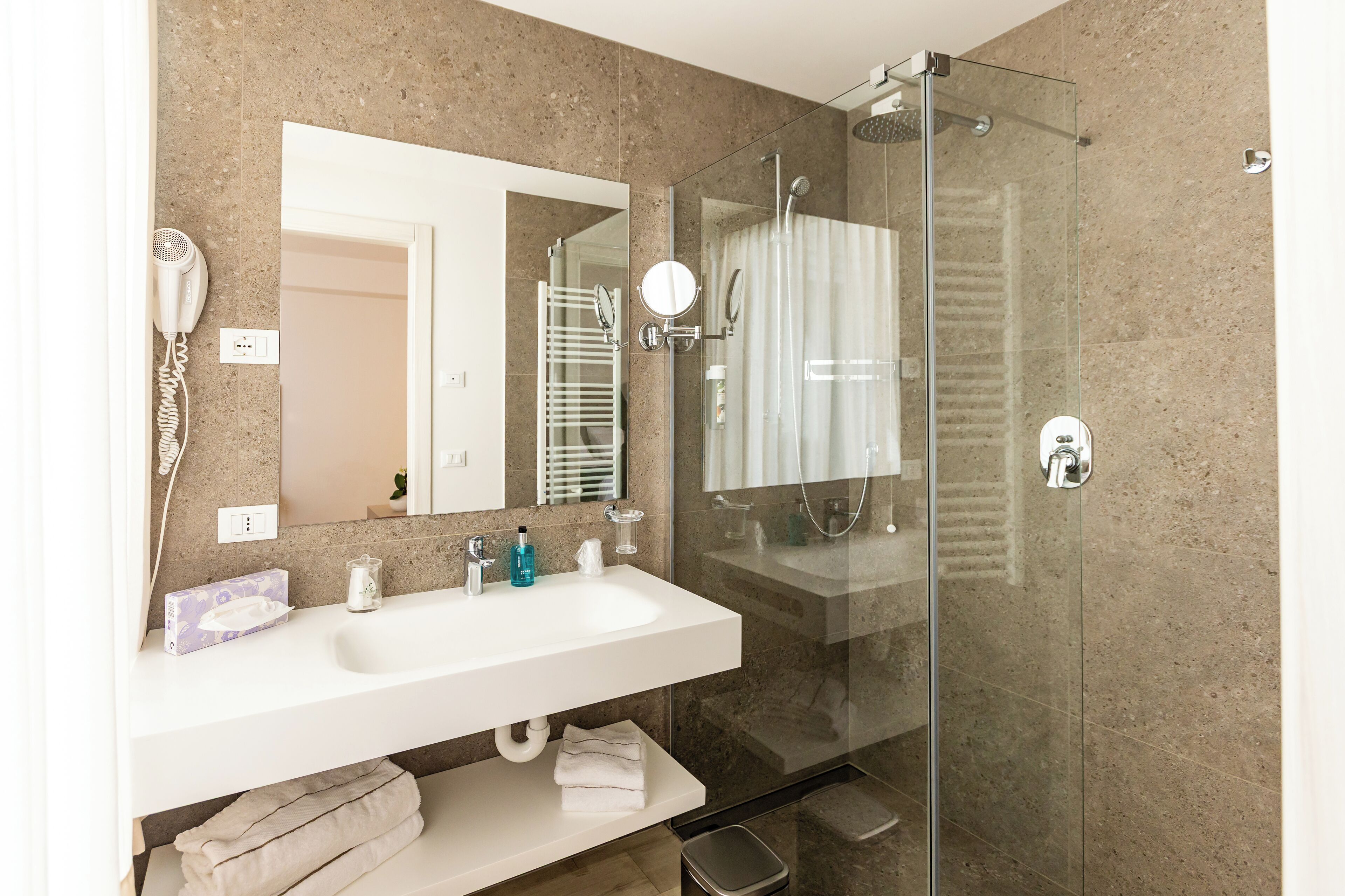 junior suite, lake view | bathroom | shower, free toiletries, hair dryer, bathrobes
