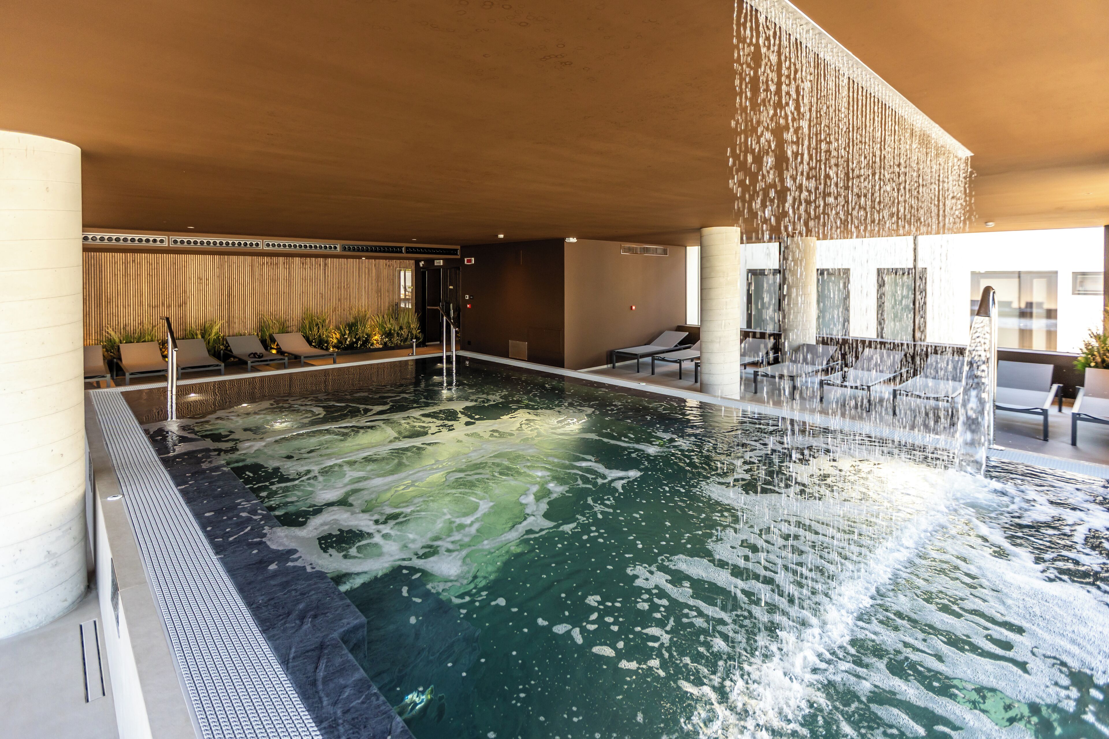 indoor pool, seasonal outdoor pool, pool umbrellas, pool loungers