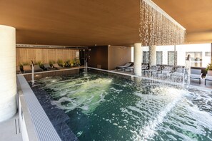 Indoor pool, seasonal outdoor pool, pool umbrellas, pool loungers