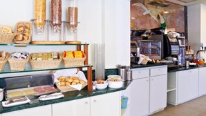 A buffet area with various food items and condiments. - Hotel Sirio (Camaiore)