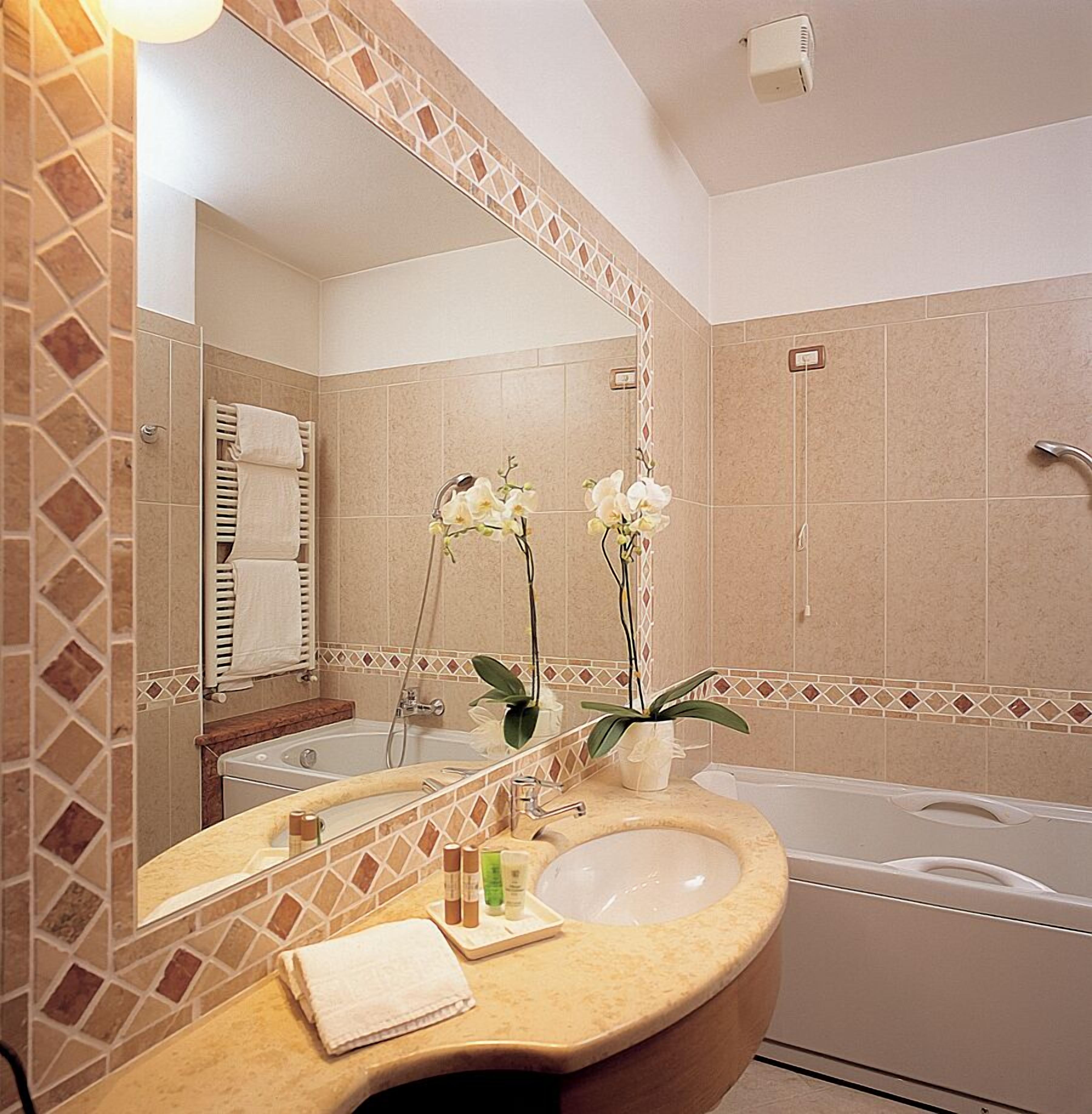 superior triple room | bathroom | hair dryer, slippers, bidet, towels