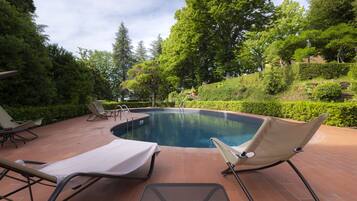 Seasonal outdoor pool, open 9:00 AM to 7:00 PM, pool umbrellas