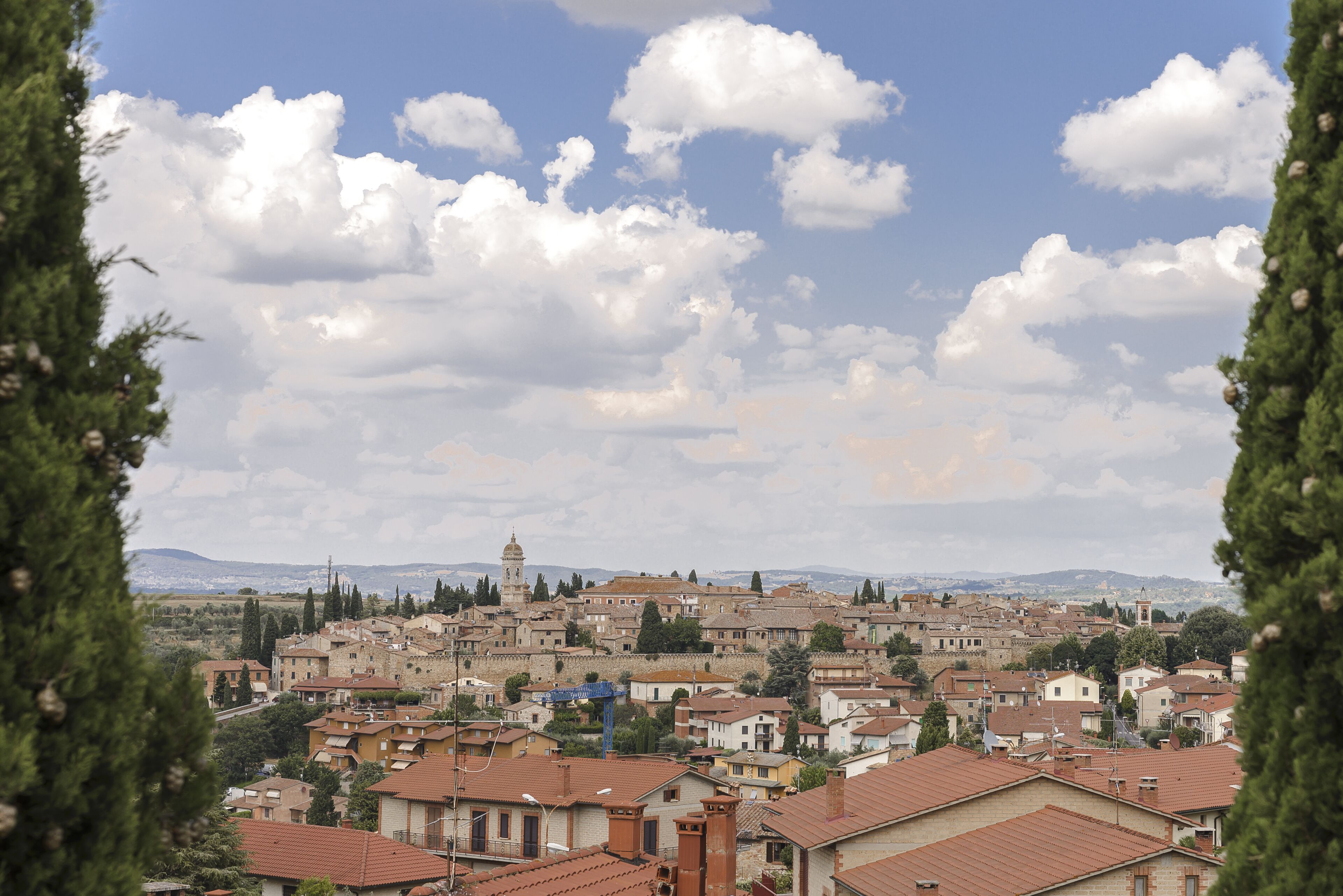 A historic town with traditional architecture, a prominent tower, and a mix of residential and commercial buildings.
