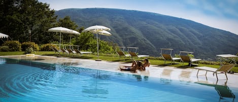 Seasonal outdoor pool, pool loungers