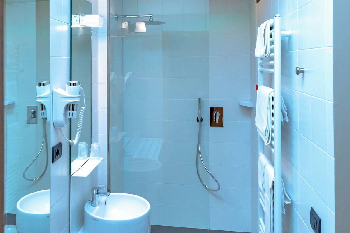 superior quadruple room | bathroom | shower, rainfall showerhead, free toiletries, hair dryer
